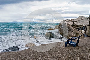 View of the sinking chair in front of the sea with soft gentle w