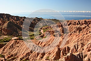 View of Skazka, or Fairytale, canyon and Issyk-Kul lake. Kyrgyzstan