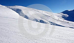 View of the ski slopes in the resort of Sinaia on a sunny day.