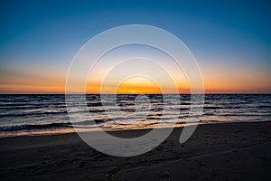 The view of the sky above the beach is very beautiful after sunset. Late evening by the Baltic Sea