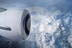 View of the sky and clouds from the airplane porthole. jet engine turbine look through aircraft window