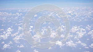 View of sky and clouds through airplane window