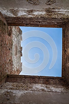 View of the sky from a Crenellated Tower of the Ancient Italian Walled City of Soave in the Verona area. photo