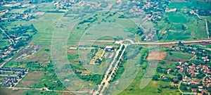 View from the sky of a landscape of rice fields and settlements