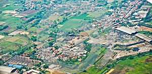 View from the sky of a landscape of rice fields and settlements