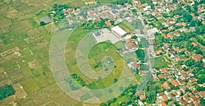 View from the sky of a landscape of rice fields and settlements