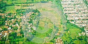 View from the sky of a landscape of rice fields and settlements