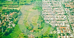 View from the sky of a landscape of rice fields and settlements