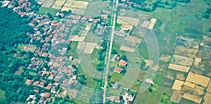 View from the sky of a landscape of rice fields and settlements