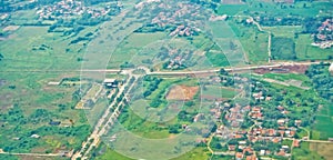 View from the sky of a landscape of rice fields and settlements