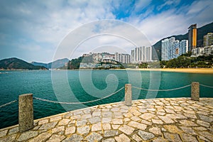 View of skyscrapers and beach from a pier at Repulse Bay, in Hon