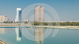 View of skyscrapers skyline with Al Bahr towers in Abu Dhabi timelapse. United Arab Emirates