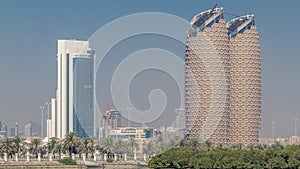 View of skyscrapers skyline with Al Bahr towers in Abu Dhabi timelapse. United Arab Emirates