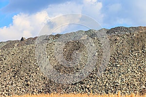 View of slag heaps of iron ore quarry. Mining industry