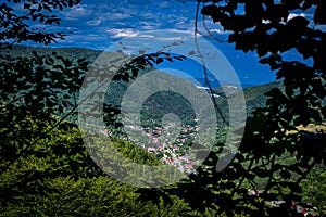 View of Slanic Moldova city in Bacau Romania from the mountains in summer sun