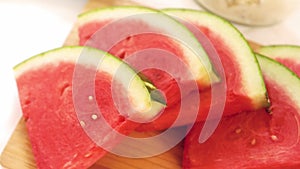 View of slices of watermelon on a wooden board