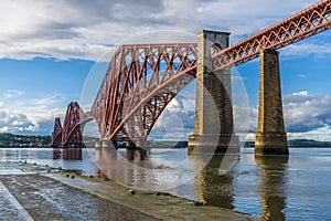 A view from a slipway in Queensferry of the Forth Railway bridge over the Firth of Forth, Scotland