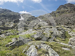 View on slope of mountain peak ridge at Niederl saddle at Stubai hiking trail, Stubai Hohenweg, Summer rocky alpine