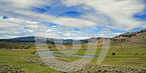 View of Slough Creek under cirrus cumulus clouds in the Lamar Valley of Yellowstone National Park in Wyoming