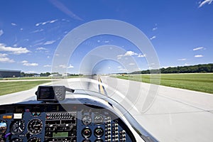 View from small aircraft taking off from runway