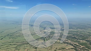 View from a small airplane over the savannah of the Masai Mara Park