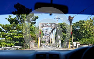 View of the small bridge with serial movement from a car window. Jamaica.