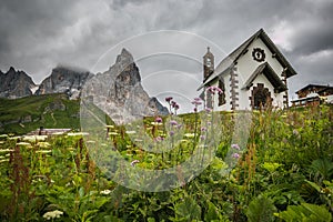 View of small church in the famous Passo Rolle with Pale di San Martino in the background, Italian dolomites, Trentino