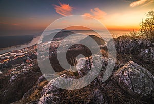 View of a Small City near a River at Sunrise