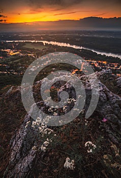 View of Small City with River from the Hill at Sunset