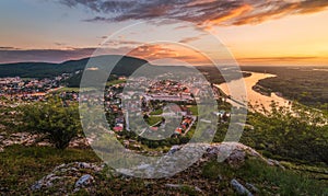 View of Small City with River from the Hill at Sunset