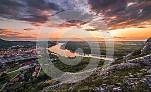 View of Small City with River from the Hill at Sunset