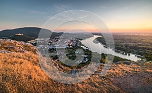 View of Small City with River from the Hill at Sunset