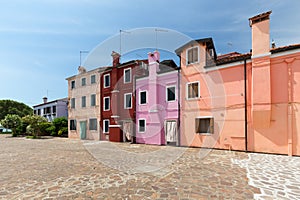 View of the Small, cozy courtyard with colorful cottage / Burano, Venice/ The small yard with bright walls of houses