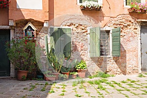 View of the Small, cozy courtyard with colorful cottage / Venice/ The small yard with bright walls of houses