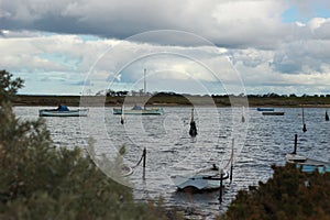 view of small fishing sail boats tide up in port in an inlet at Werribee south beach, Werribee Victoria