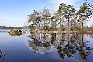 View of a small island, situated in a lake, typical for the south of Sweden