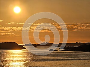 VIew on small islets in a north sea at sunset