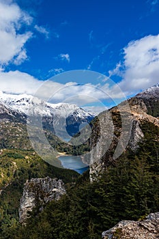 View of a small lagoon between hills and forests