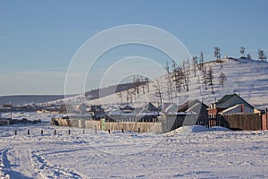 View of small local village and forest mountain in winter at Khovsgol in Mongolia