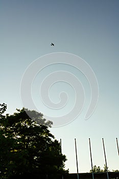 View of a small propeller airplane flying at high altitude