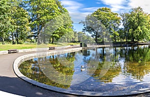 A view of a small shallow pond in the centre of Duthie Park, Aberdeen