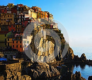 View of small village built on the rocks. Manarola. Village between mountains and the Ligurian sea