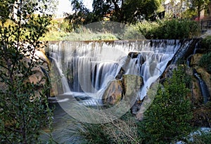 View of a small waterfall in the middle of a forest