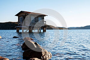 View of small wooden house on stilts in a bay of Dalniye Zelentsy