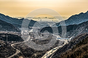 View on smog over Bejing in China from the top of thee Great Chinese Wall in the mountains near Bejing