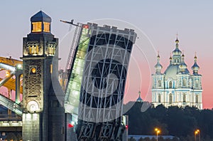 View of the Smolny Cathedral and the divorced Bolsheokhtinsky bridge during the white nights. St. Petersburg. Russia
