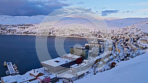 View of snow-covered city center of Hammerfest, Norway, the northernmost town in the world, located at the coast of arctic sea.