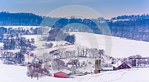 View of snow-covered farm fields and rolling hills in rural York