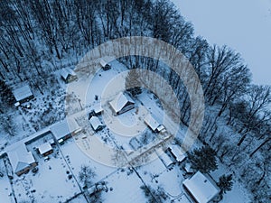 view of snow-covered houses in a cottage and country village