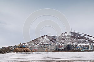 View of the snow-covered Kultushnoe Lake in Petropavlovsk-Kamchatsky in winter in sunny weather